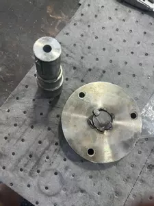 Damaged pump-to-engine drive shaft and coupling removed during industrial diesel hot pressure washer repair in Dover